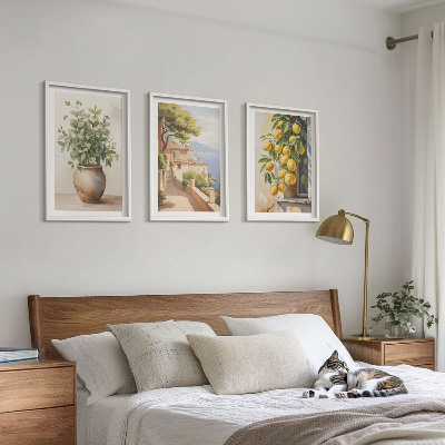 Tavelset ovanför soffa Blommor i en vas, ett hav av citroner