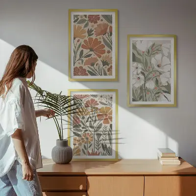 Tavelset med ramar blommönster i orange och grönt