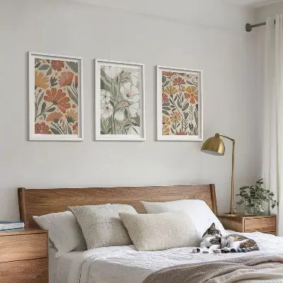 Tavelset med ramar blommönster i orange och grönt