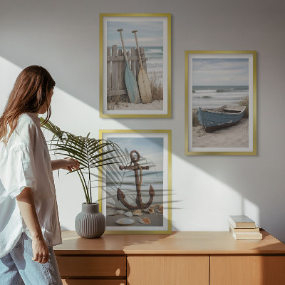 Tavelset ovanför soffa strand båt ankare sand