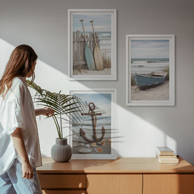 Tavelset ovanför soffa strand båt ankare sand