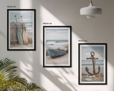Tavelset ovanför soffa strand båt ankare sand