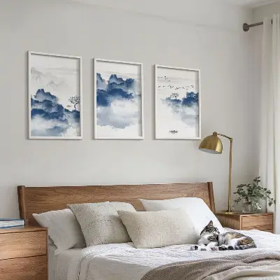 Tavloset med motiv av berg, moln, träd och fåglar set om 3 stycken