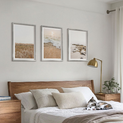 Tavelset ovanför soffa Strandvågor stenar sommar