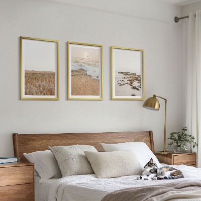 Tavelset ovanför soffa Strandvågor stenar sommar