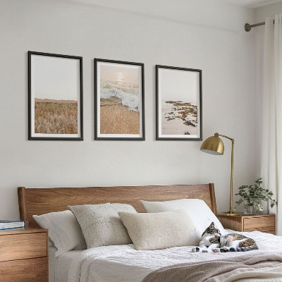 Tavelset ovanför soffa Strandvågor stenar sommar