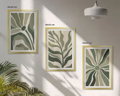 Tavelset ovanför soffa med gröna och beige växtmönster