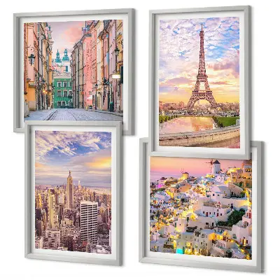 Tavelvägg ovanför soffa med motiv av New York, Paris, Oia och Warszawa i skymning