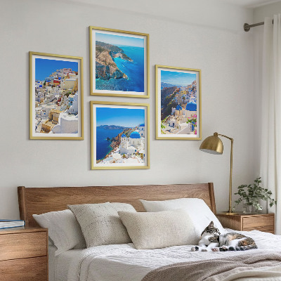 Tavelvägg ovanför soffa Arkitektoniskt landskap Oia Santorini Grekland