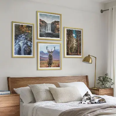 Set med 4 tavlor med motiv av vattenfall, skog, berg och rådjur