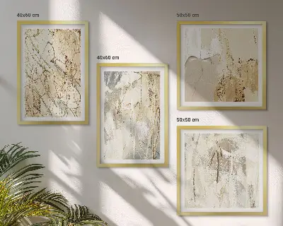 Tavelvägg ovanför soffa med beige abstrakta former och linjer