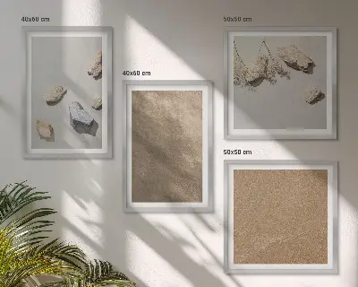 Tavelvägg med 4 tavlor med motiv av naturliga strandstenar